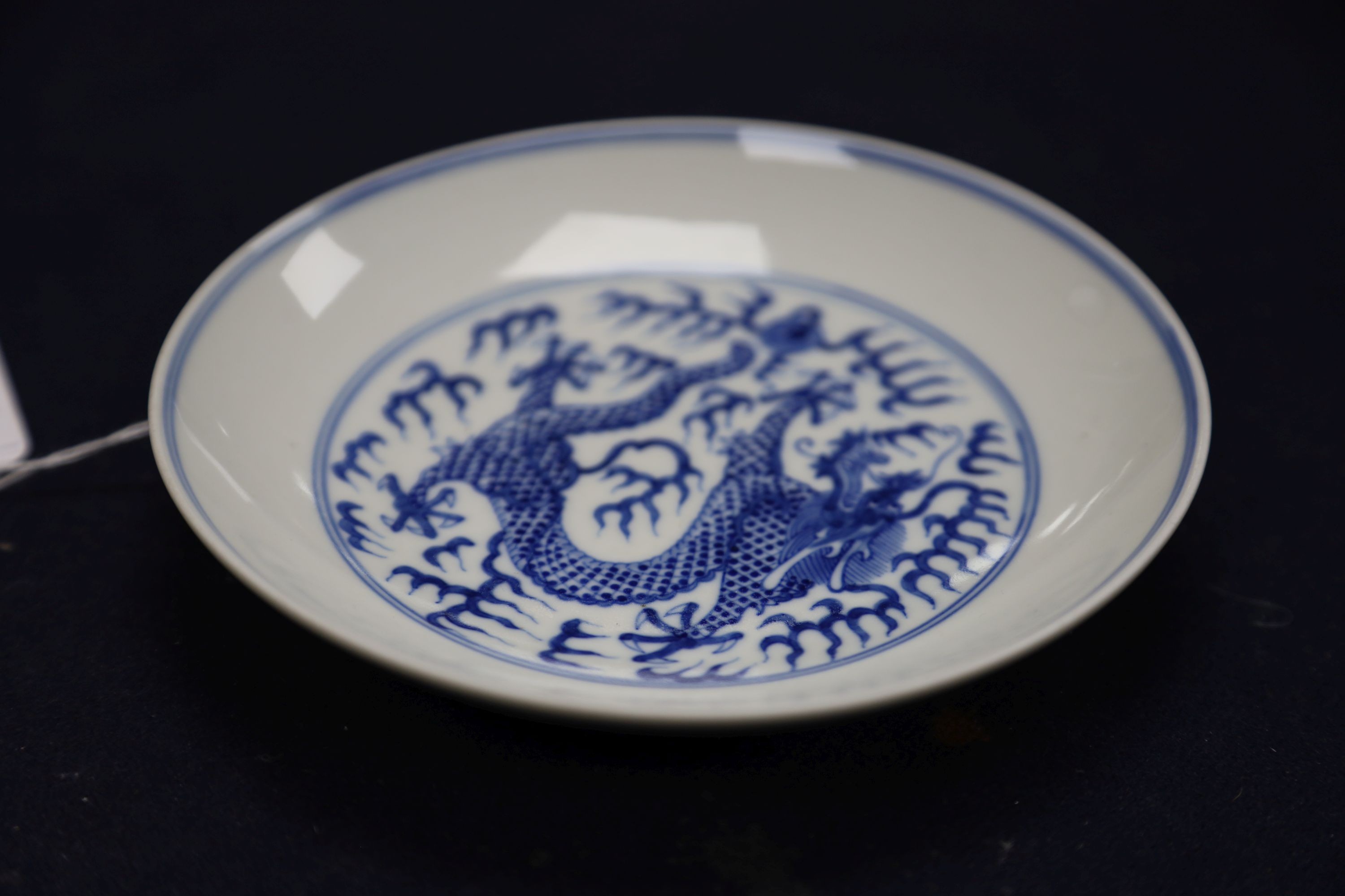 A Chinese blue and white landscape bowl, a/f and a Chinese blue and white 'dragon' dish, 18cm and 16.5cm